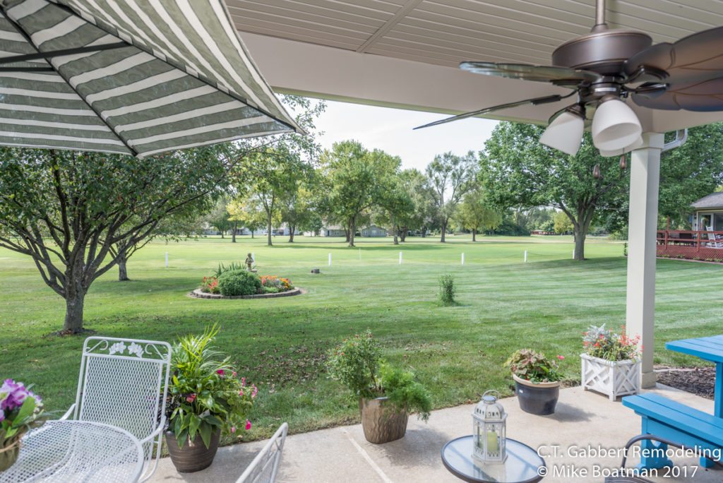 green backyard view with enclosed porch