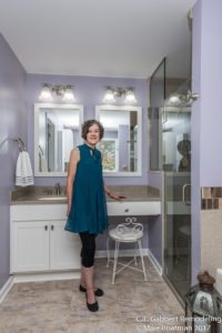 happy customer in her lavender bathroom suite