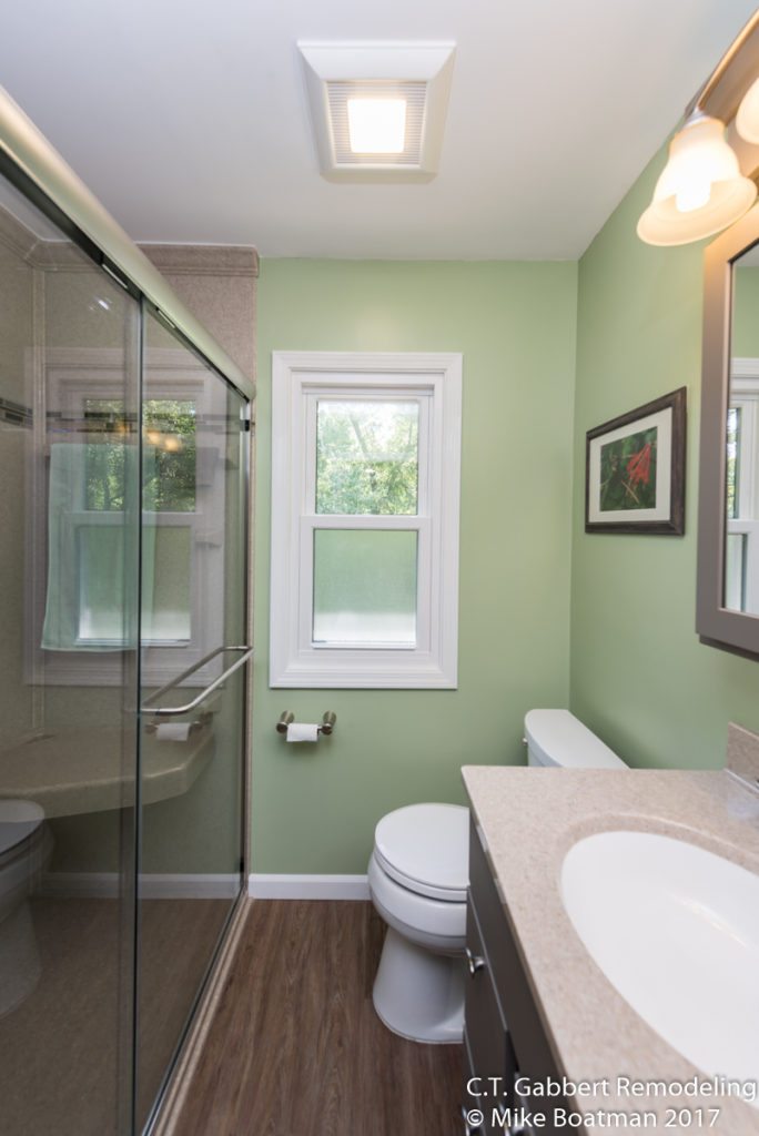 light green walls in fresh clean bathroom remodel