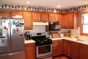 before remodeled kitchen with dated wallpaper