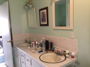 green blue walls in with his and her sinks before the remodel