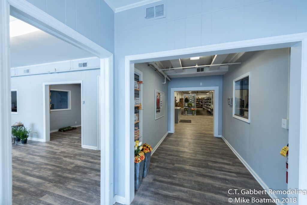 vinyl plank flooring with wood grain and blue gray painted walls