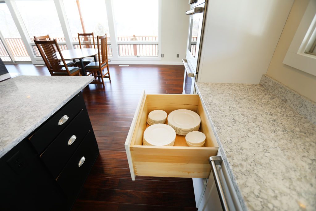 deep inset cabinet drawers holding plates and bowls
