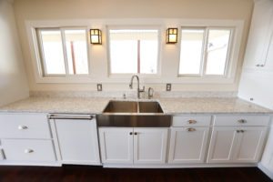 white perimeter cabinets with farmhouse sink