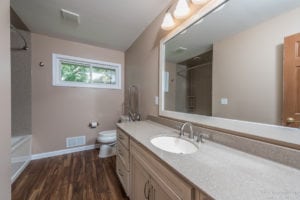 new cabinets with neutral colors in upgraded bathroom