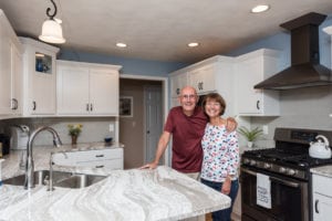 happy customers in their newly remodeled kitchen