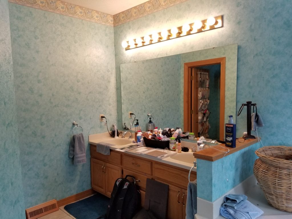 old outdated blue and brown bathroom before remodel