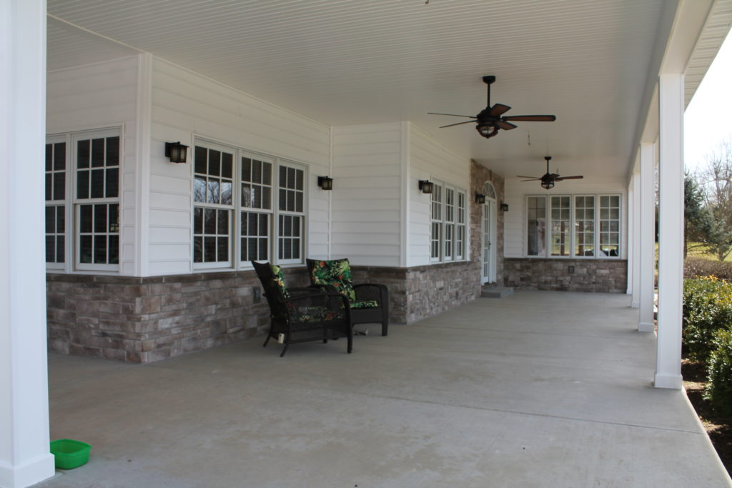 ceiling fans and stone on a new porch remodeled